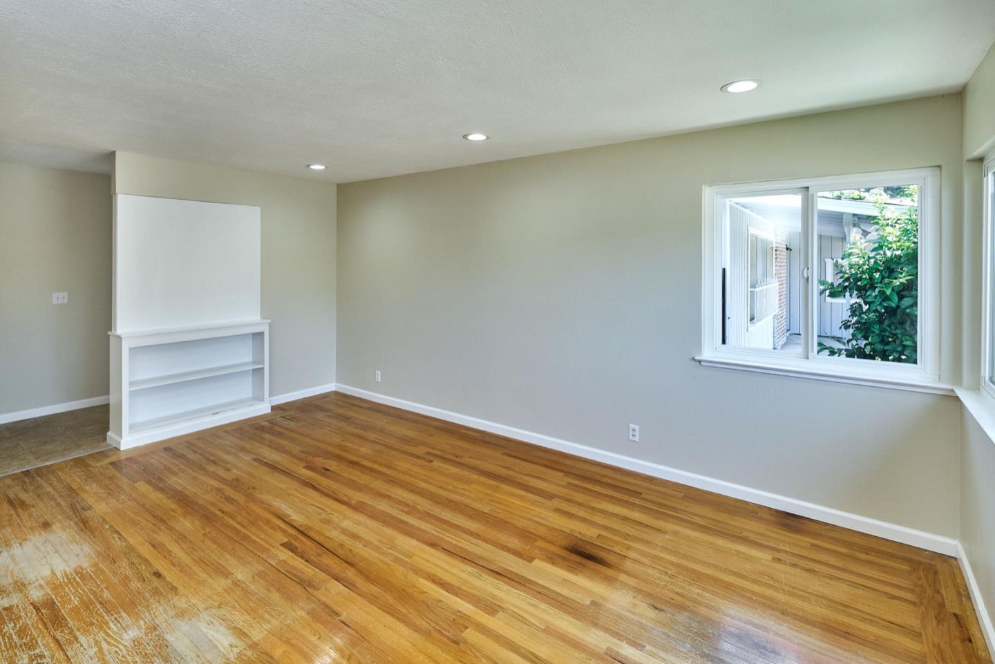 4841 Borina Drive San Jose, CA 95129 - Photo 4 of 26 a view of empty room with wooden floor and fan