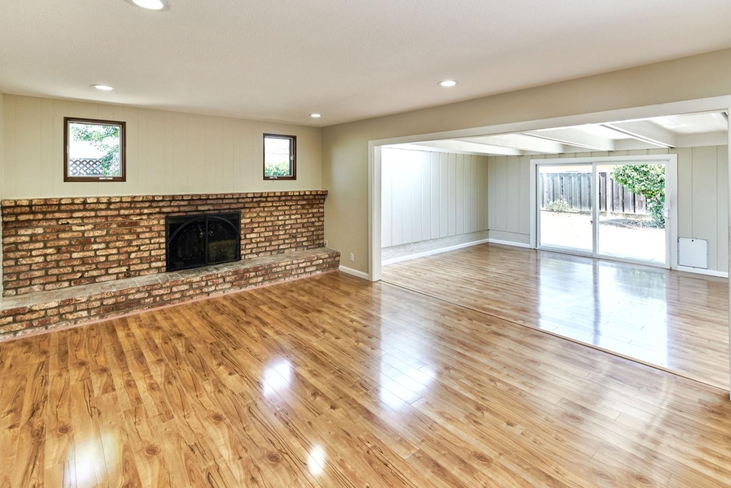 4841 Borina Drive San Jose, CA 95129 - Photo 10 of 26 a view of a livingroom with wooden floor and a fireplace