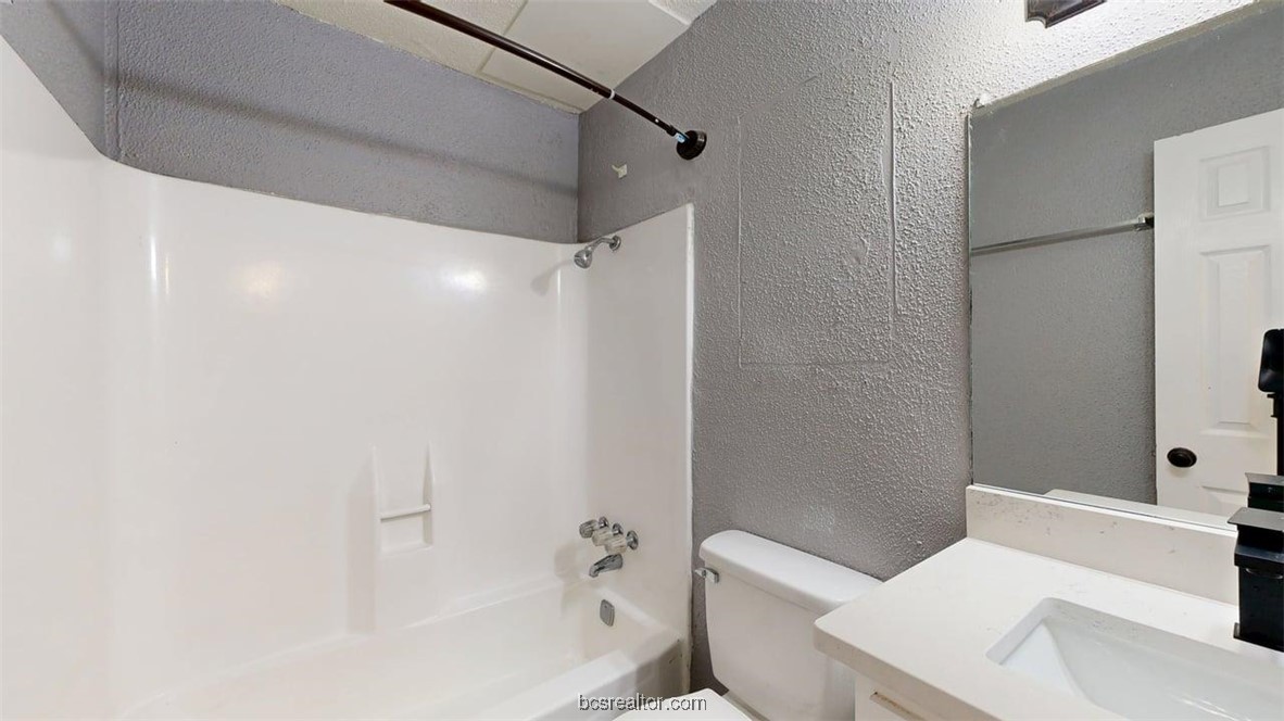 1524 Pine Ridge Drive, Unit B College Station, TX 77840 - Photo 15 of 21 a bathroom with a sink a toilet and shower