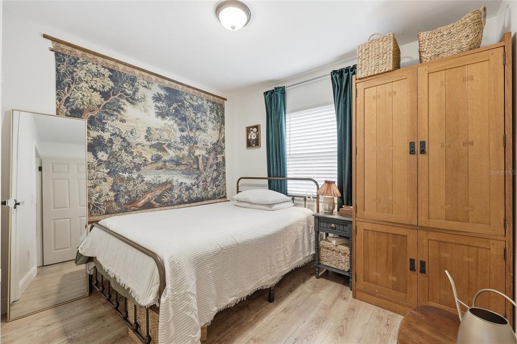 14285 Southwest 174th Street Archer, FL 32618 - Photo 12 of 25 a bedroom with a bed and a dresser