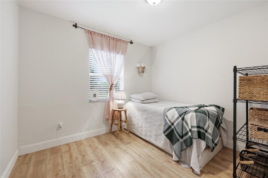 14285 Southwest 174th Street Archer, FL 32618 - Photo 14 of 25 a bedroom with a bed and a window
