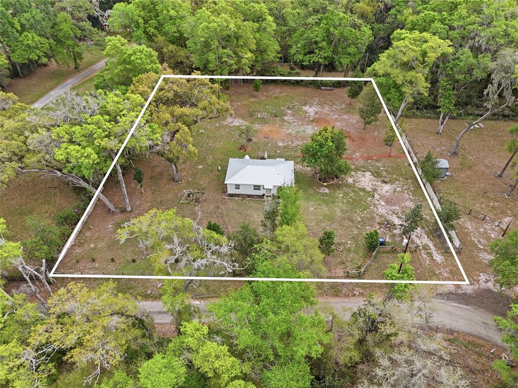 14285 Southwest 174th Street Archer, FL 32618 - Photo 18 of 25 a view of a backyard