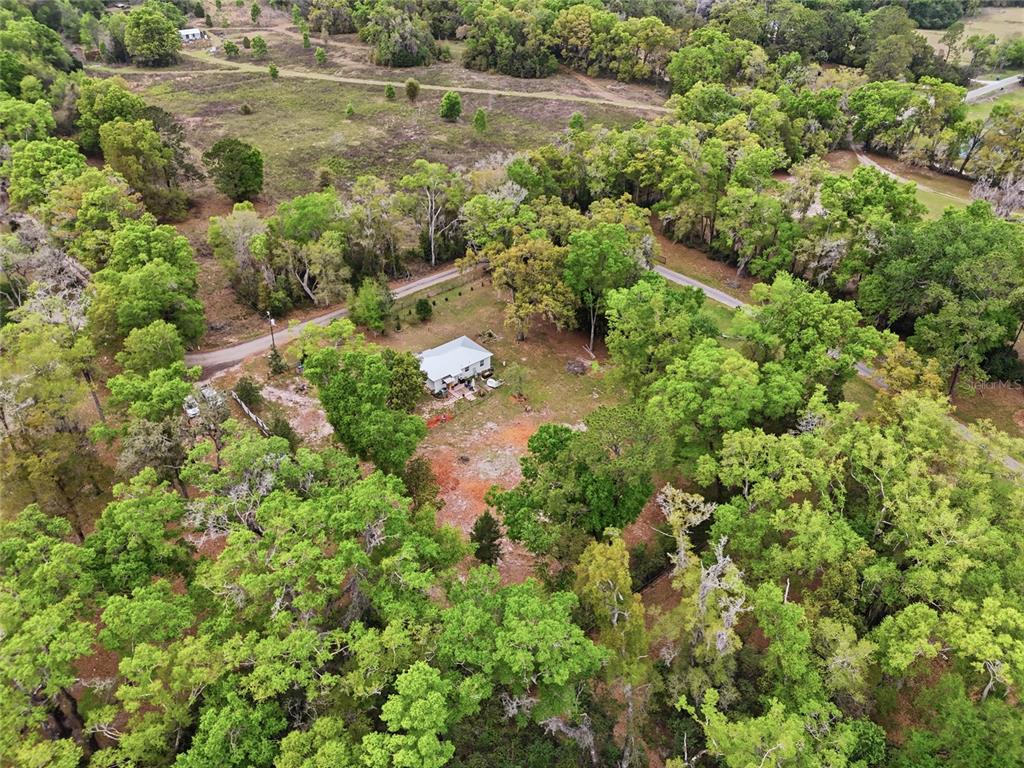 14285 Southwest 174th Street Archer, FL 32618 - Photo 21 of 25 an aerial view of residential house with outdoor space and trees all around