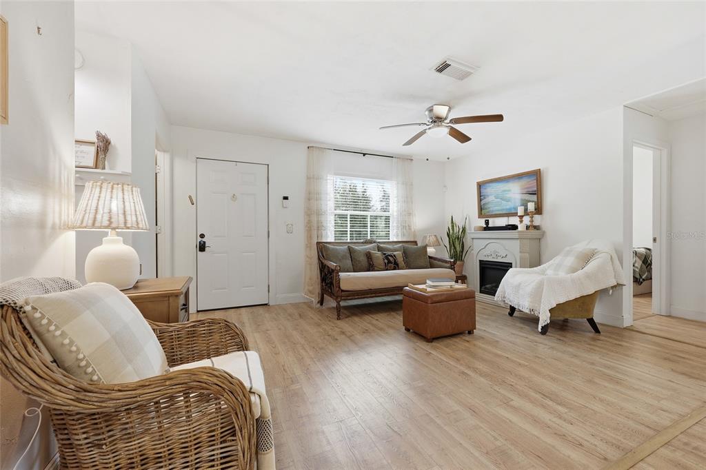 14285 Southwest 174th Street Archer, FL 32618 - Photo 3 of 25 a living room with furniture and wooden floor