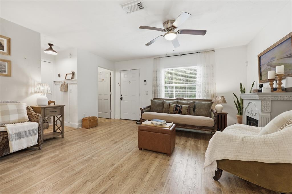 14285 Southwest 174th Street Archer, FL 32618 - Photo 4 of 25 a living room with furniture and a large window