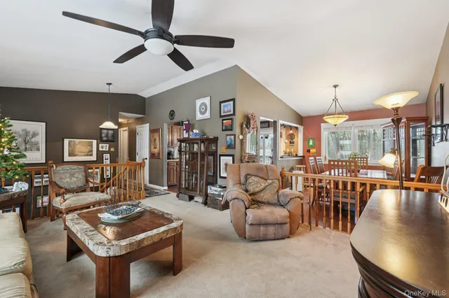 a view of a dining room with furniture wooden floor and a chandelier