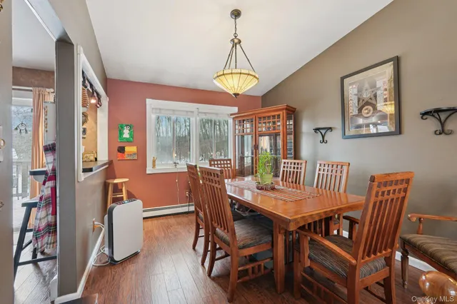 a bathroom with a granite countertop sink toilet a mirror and shower