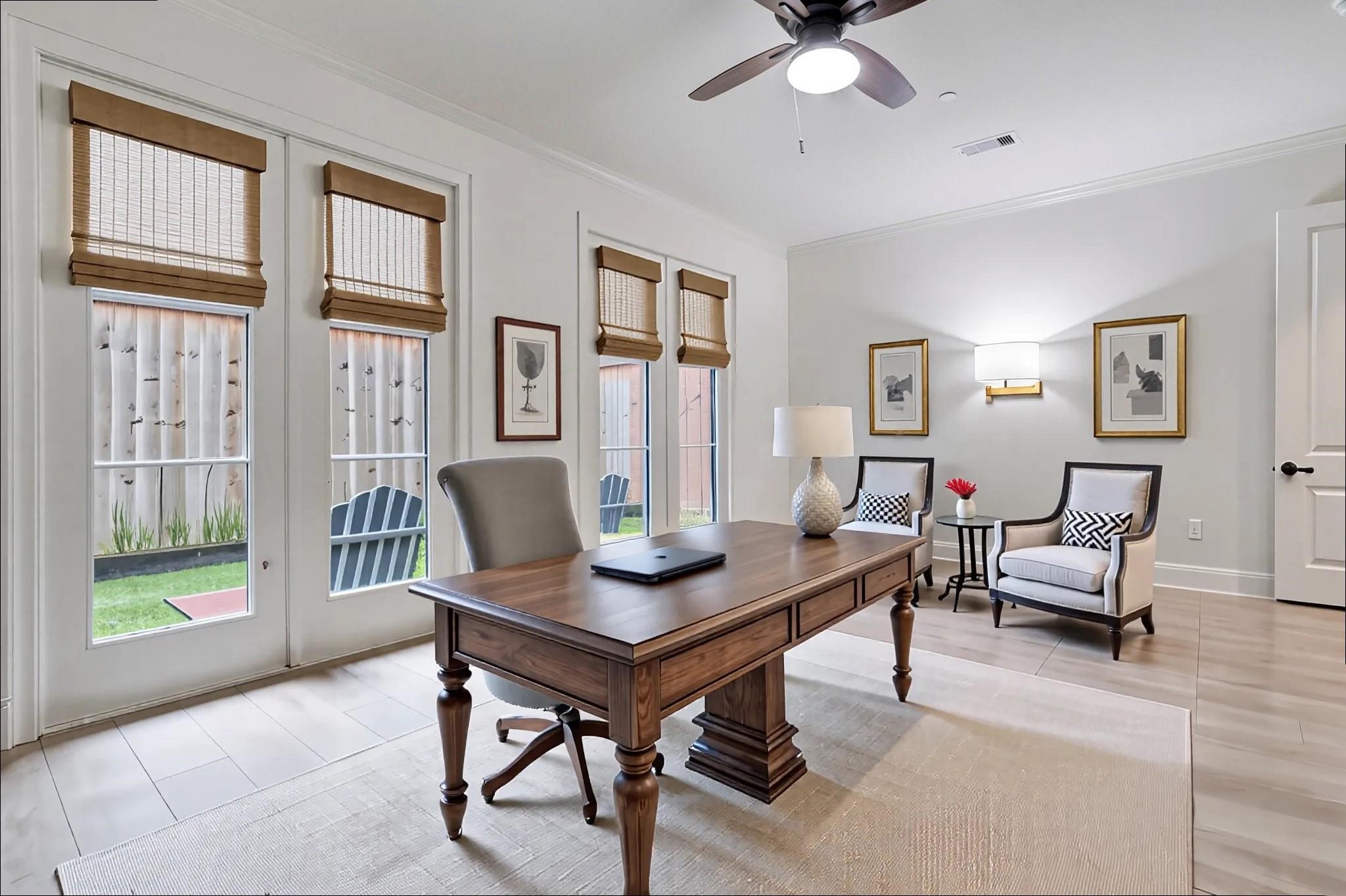 5218 Crawford Street Houston, TX 77004 - Photo 13 of 22 Th first floor offers a large bedroom with ensuite bath and walk-in closet. The owners enjoyed using it as an office. Access here to the fenced in back yard. Virtually Staged