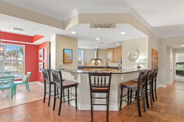 a view of a dining area with furniture and wooden floor