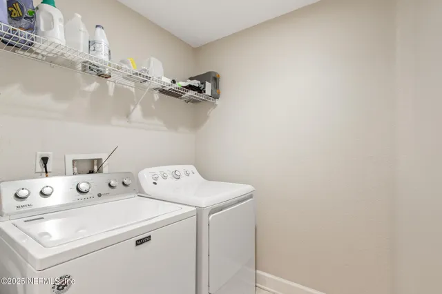 a utility room with dryer and washer