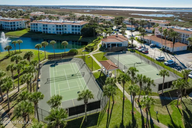 a front view of a house with garden and swimming pool
