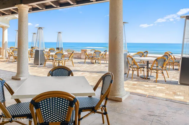 a kitchen with a dining table and chairs