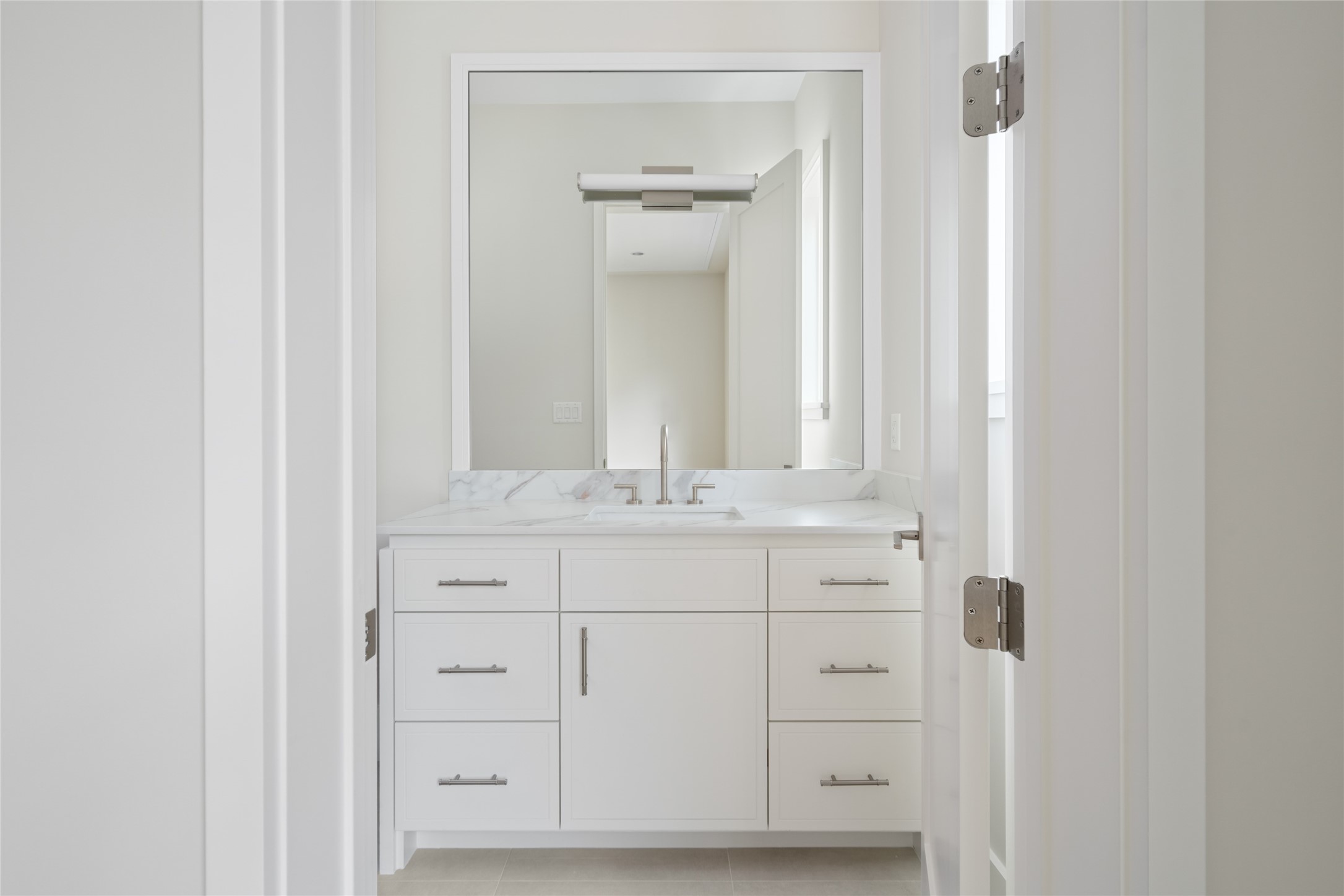 4006 Overbrook Lane Houston, TX 77027 - Photo 34 of 50 Bright secondary bath with clean-lined vanity and crisp, timeless finishes.