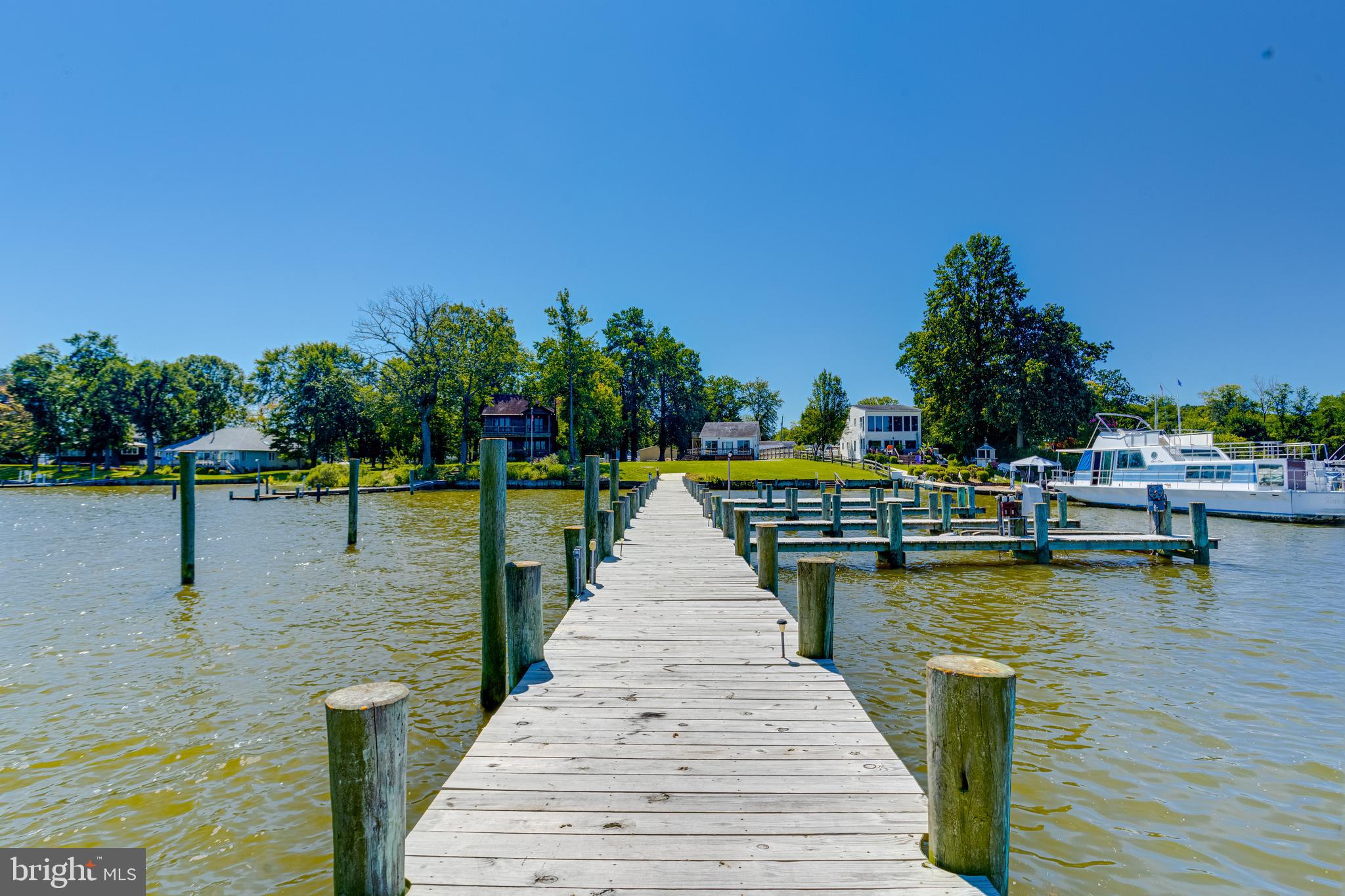 1937 Cape May Road Essex, MD 21221 - Photo 11 of 23 a view of swimming pool with seating area and trees in the background
