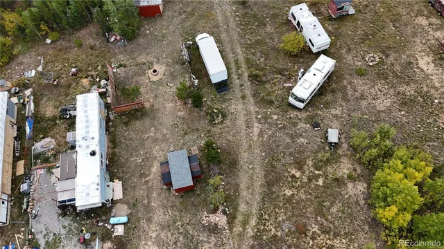 an aerial view of a house with outdoor space