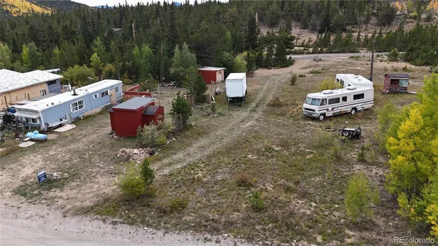 a view of a backyard with sitting area