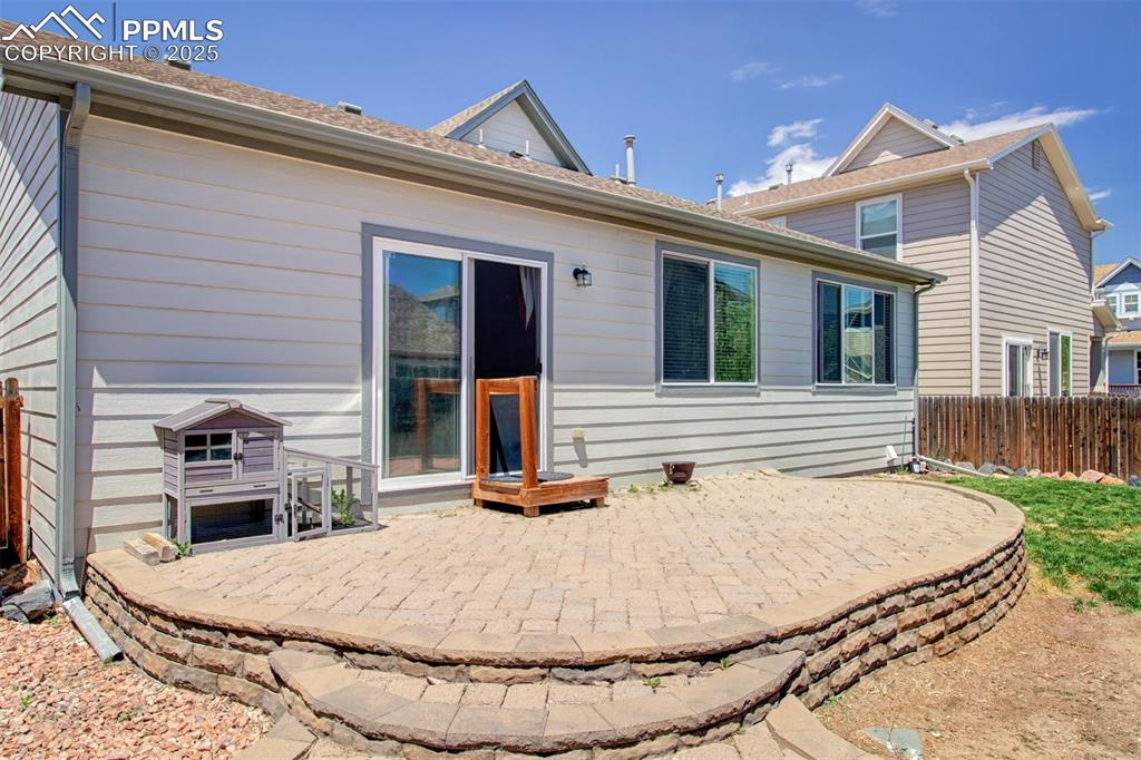 7627 Loopout Grove Peyton, CO 80831 - Photo 19 of 21 a view of a house with table and chairs