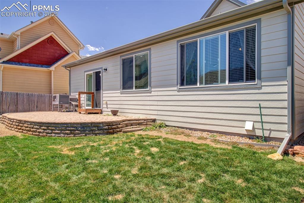 7627 Loopout Grove Peyton, CO 80831 - Photo 20 of 21 a view of house with backyard