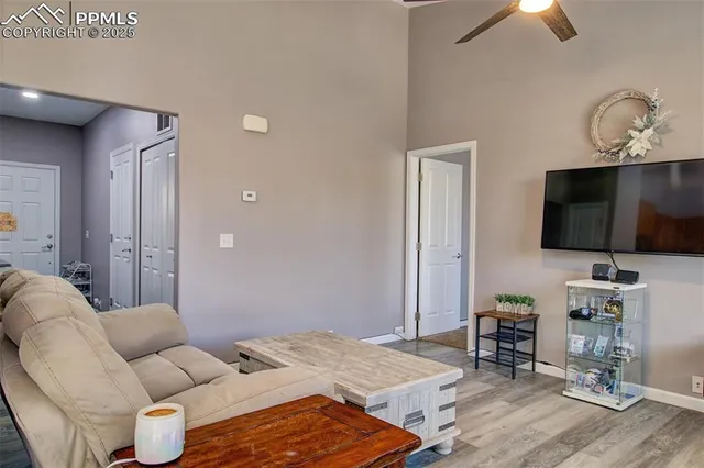 a bedroom with furniture and a flat screen tv