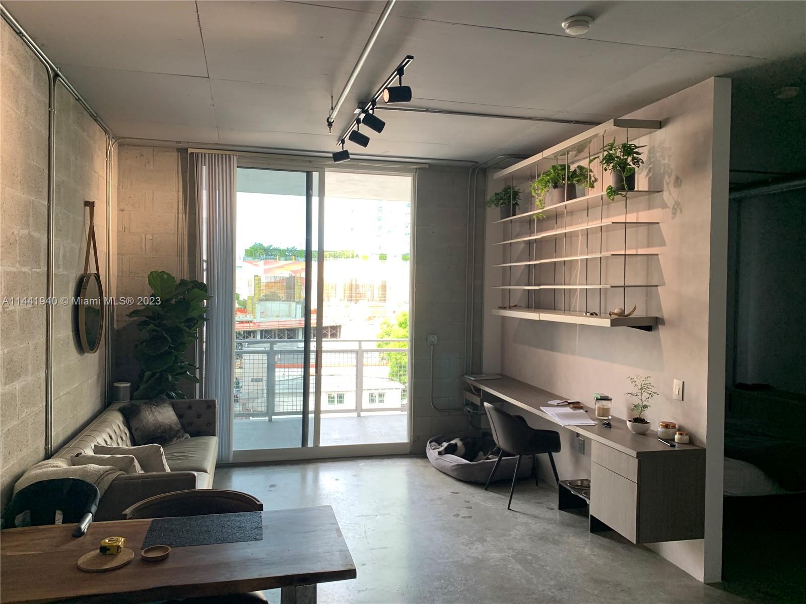 Edgewater Miami, FL 33137 - Photo 3 of 14 a room with furniture and a window