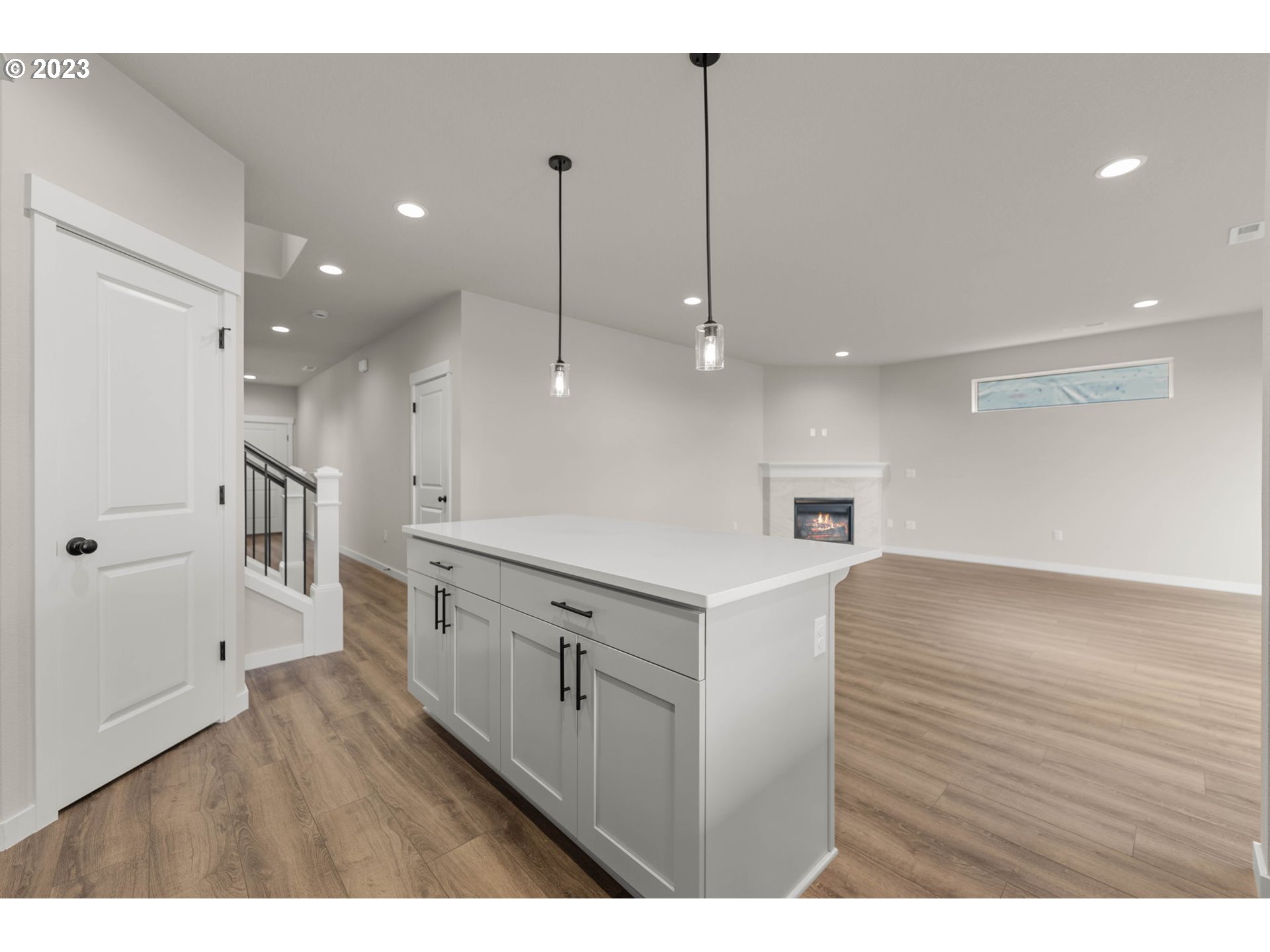 8847 North 3rd Circle Ridgefield, WA 98642 - Photo 13 of 40 a view of a kitchen with a sink and wooden floor
