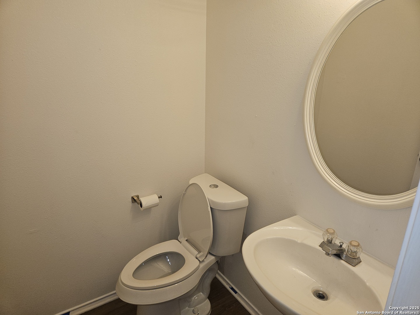 7715 Rustic Lane San Antonio, TX 78230 - Photo 13 of 26 a bathroom with a sink and a mirror