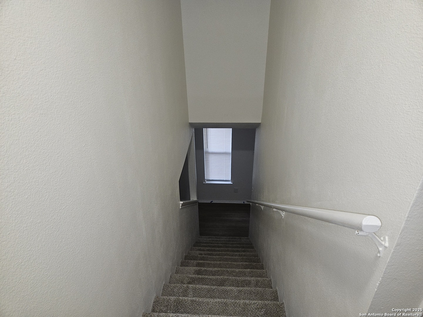 7715 Rustic Lane San Antonio, TX 78230 - Photo 15 of 26 a view of a hallway with a stairs