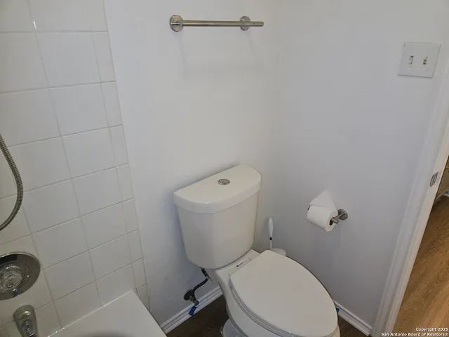 a backyard of a house with a iron fence