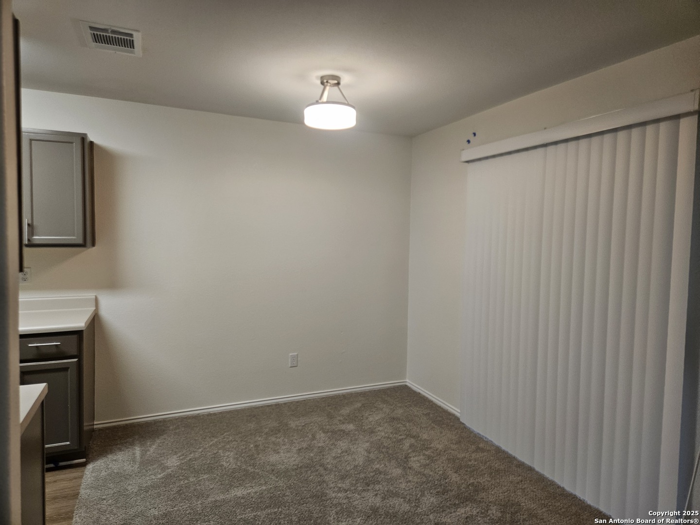 7715 Rustic Lane San Antonio, TX 78230 - Photo 5 of 26 a view of an empty room with a mirror
