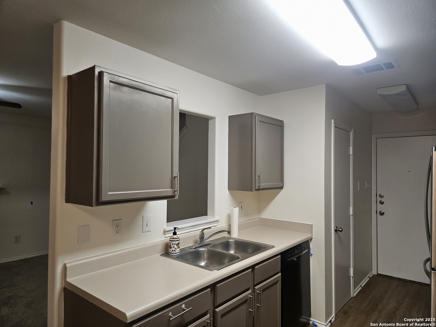 7715 Rustic Lane San Antonio, TX 78230 - Photo 7 of 26 a bathroom with a sink and a mirror