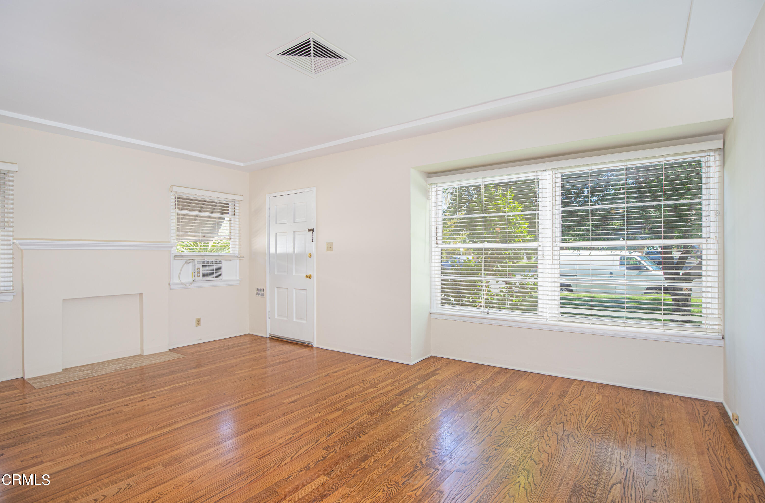1562 Riverside Drive Glendale, CA 91201 - Photo 2 of 12 a view of empty room with wooden floor and fan