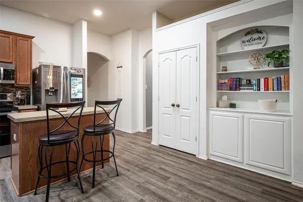 a view of kitchen with furniture and wooden floor
