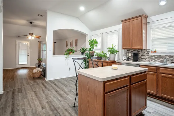 a kitchen with a sink and cabinets