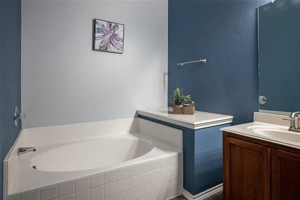 a bathroom with a bathtub sink and toilet