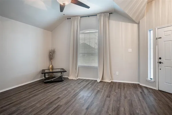 a view of room with wooden floor and chair