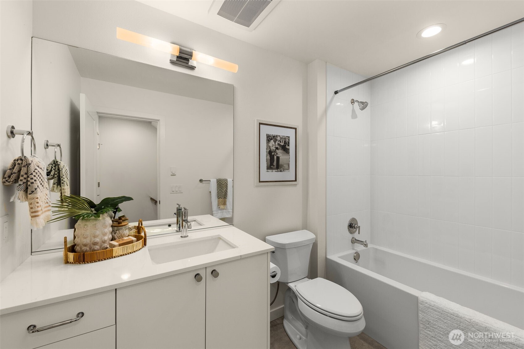 8333 12th Avenue Northwest Seattle, WA 98117 - Photo 11 of 20 a bathroom with a sink a toilet a shower and a mirror