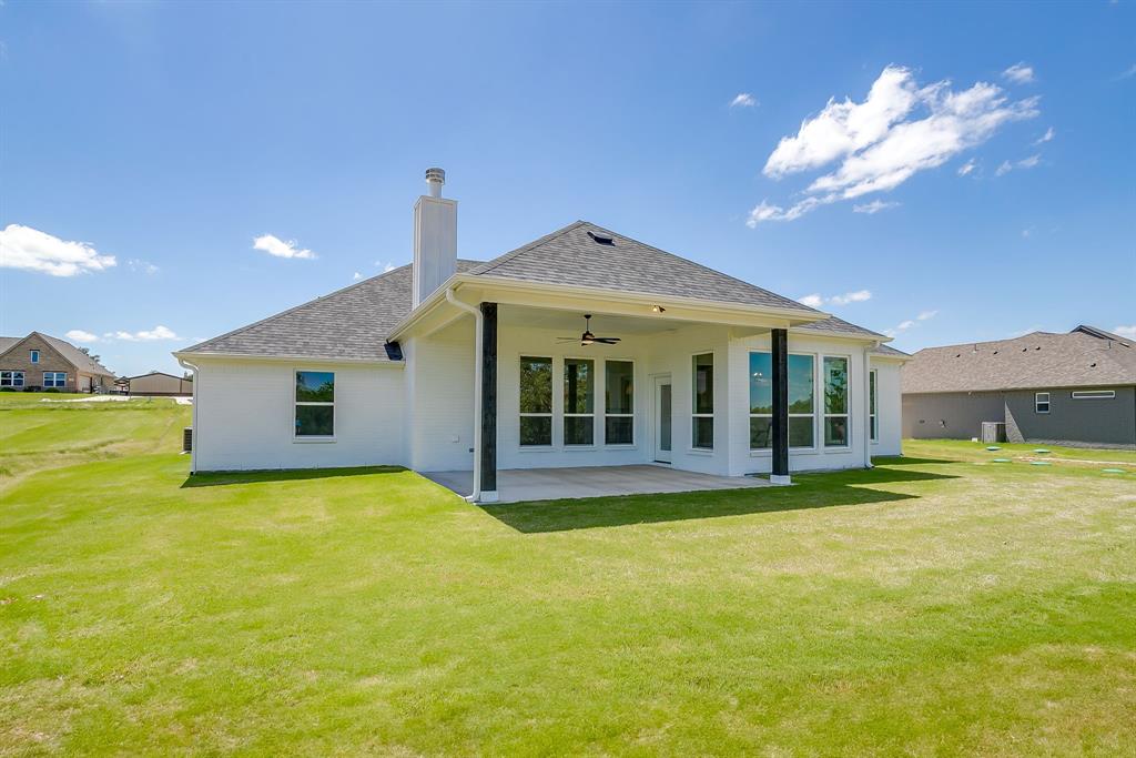 9012 Valley Oak Court Springtown, TX 76082 - Photo 39 of 40 a view of a house with a yard and swimming pool