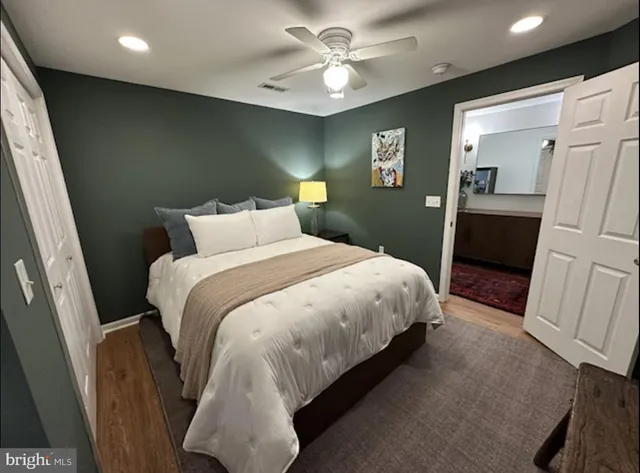 a bedroom with a bed and a walk in closet