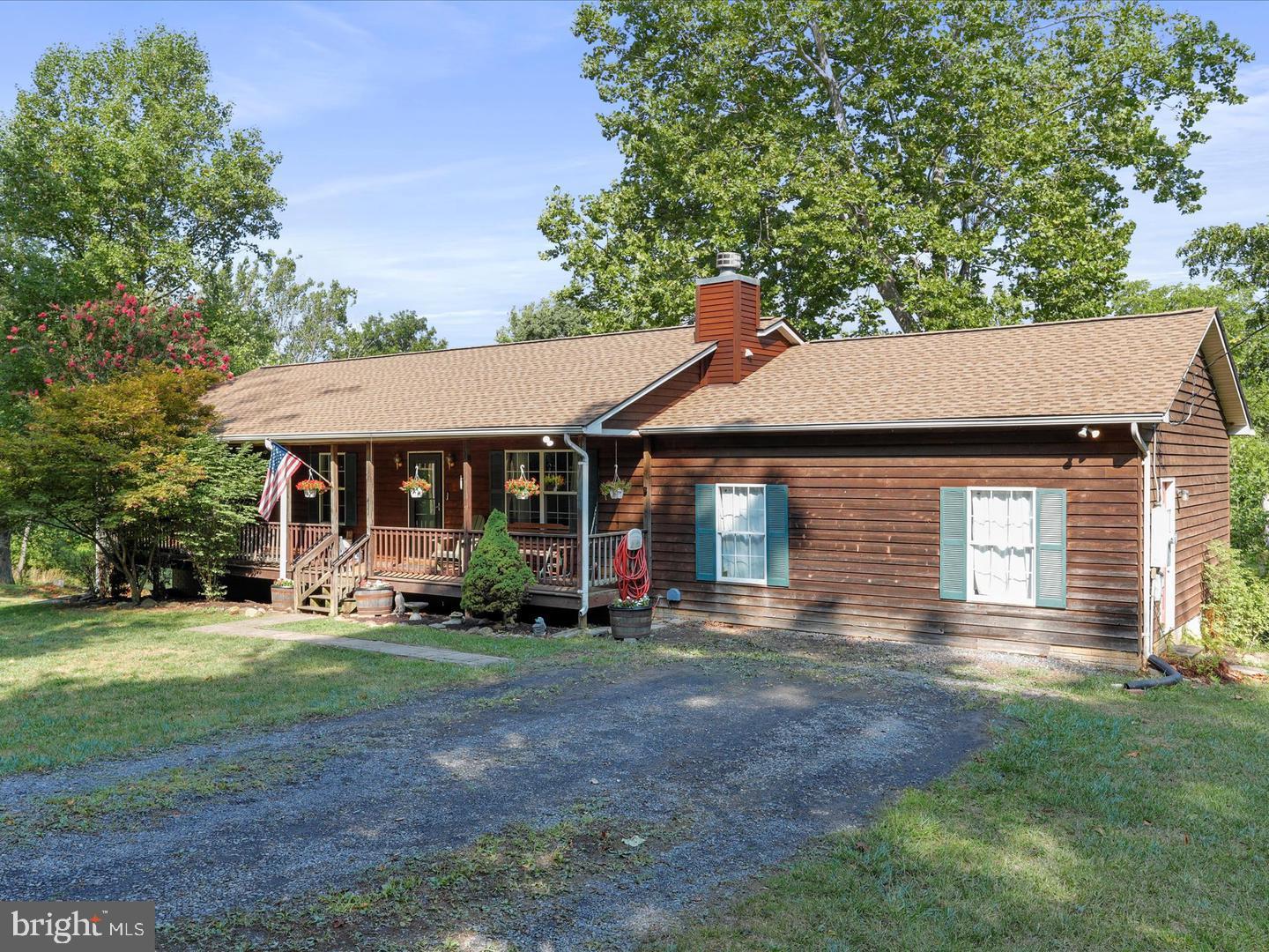 411 Whiskey Still Road Linden, VA 22642 - Photo 24 of 31 a front view of a house with a yard