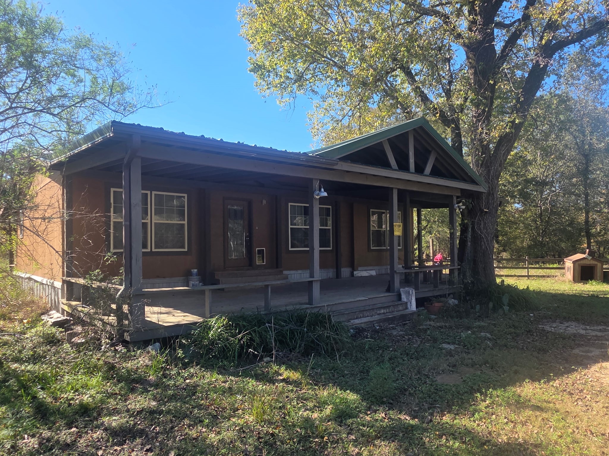 633 Ira Denson Road Coldspring, TX 77331 - Photo 3 of 27 a front view of a house with garden