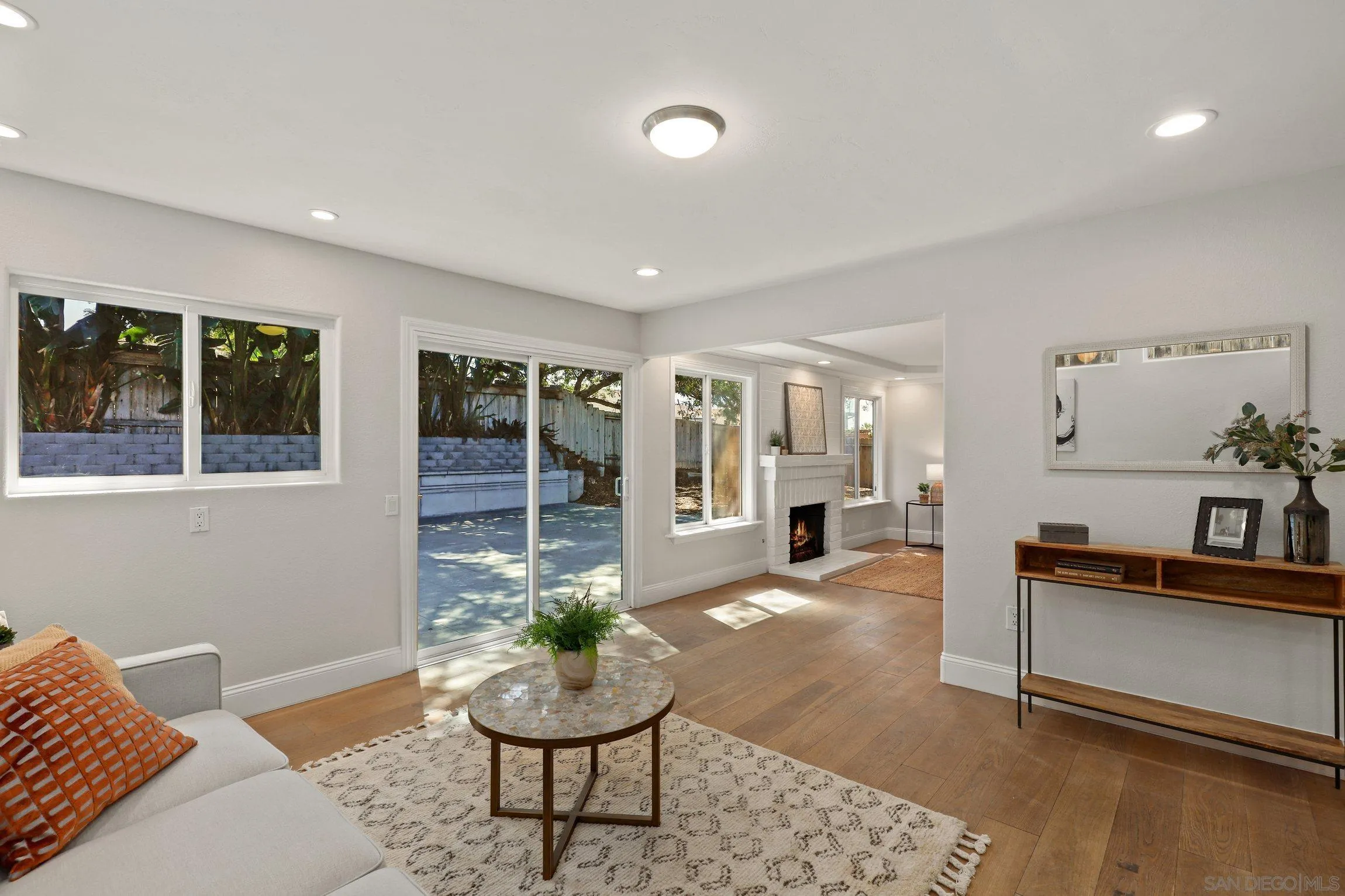 1725 Deerfield Road Encinitas, CA 92024 - Photo 3 of 31 a living room with furniture and wooden floor