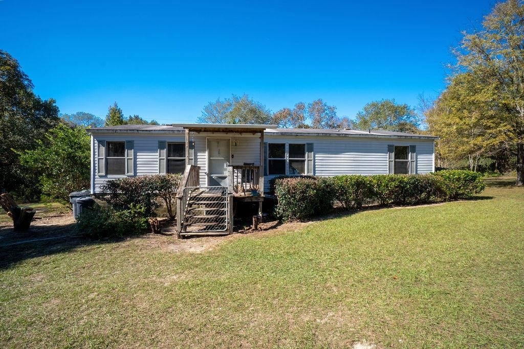 660 Zenith Mill Road Roberta, GA 31078 - Photo 1 of 1 a view of a house with backyard and sitting area