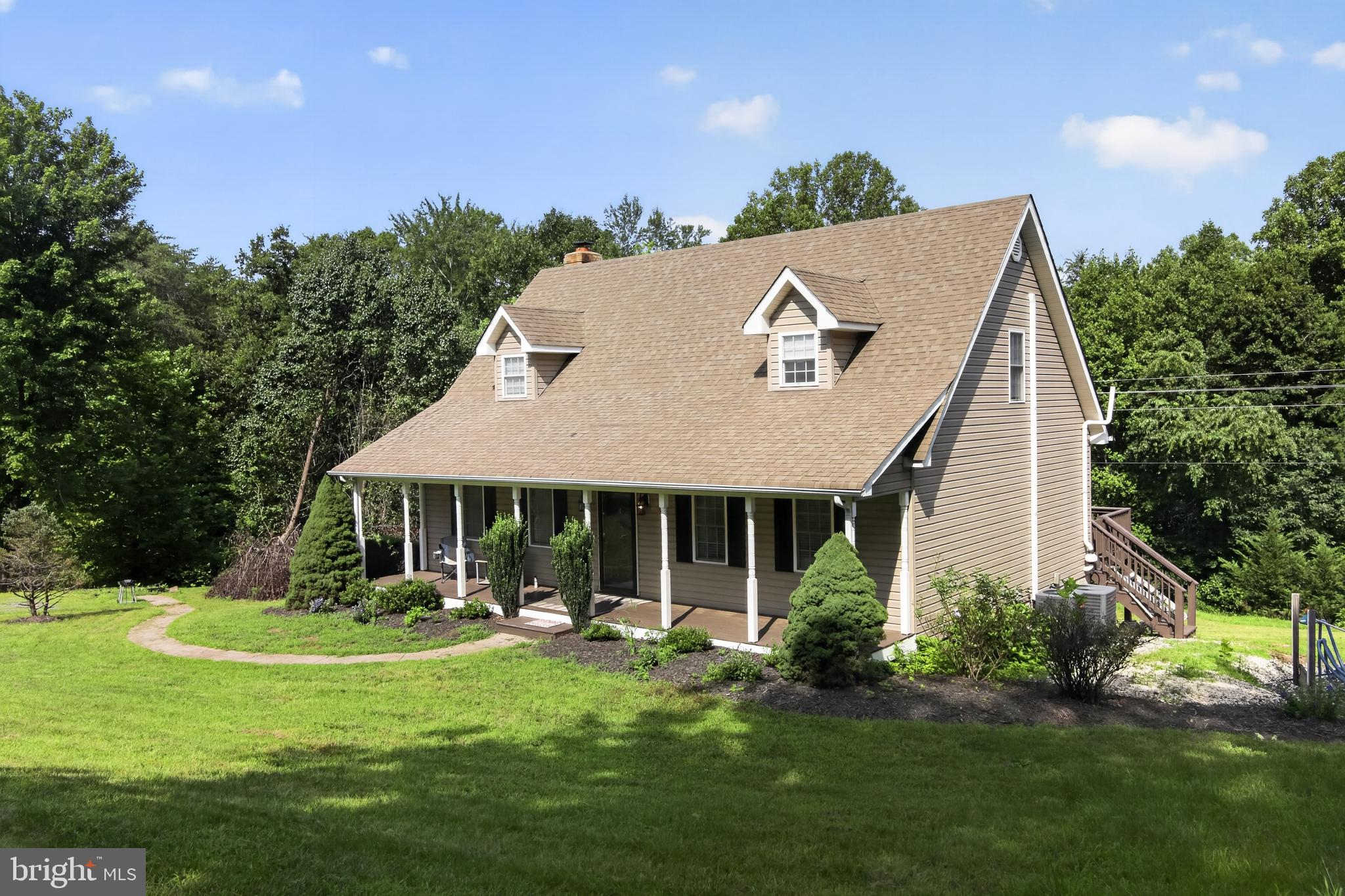 20200 Old Mill Road Culpeper, VA 22701 - Photo 2 of 31 Charming home nestled in lush greenery.