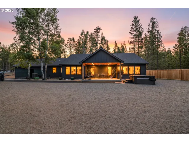 a view of a house next to a road and yard