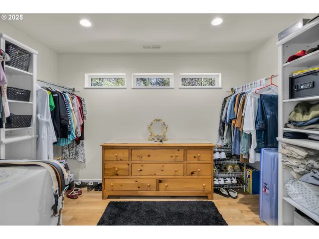 a bedroom with a bed and a flat tv screen