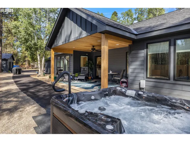 a backyard of a house with barbeque oven