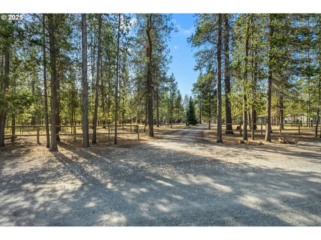 a backyard of a house with wooden fence