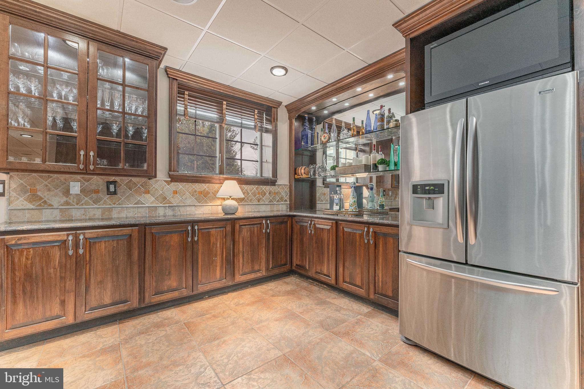 528 Old Forge Road Media, PA 19063 - Photo 65 of 84 a kitchen with stainless steel appliances granite countertop a refrigerator and a sink