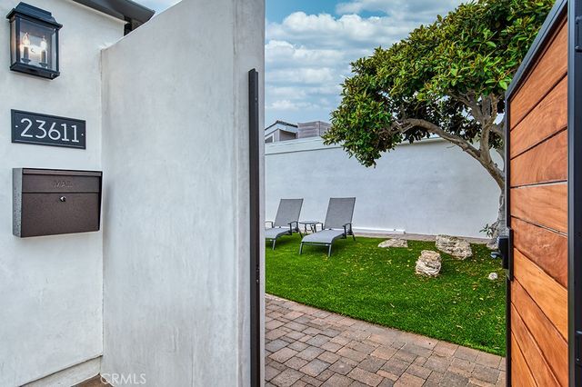 a view of an entrance to house with yard