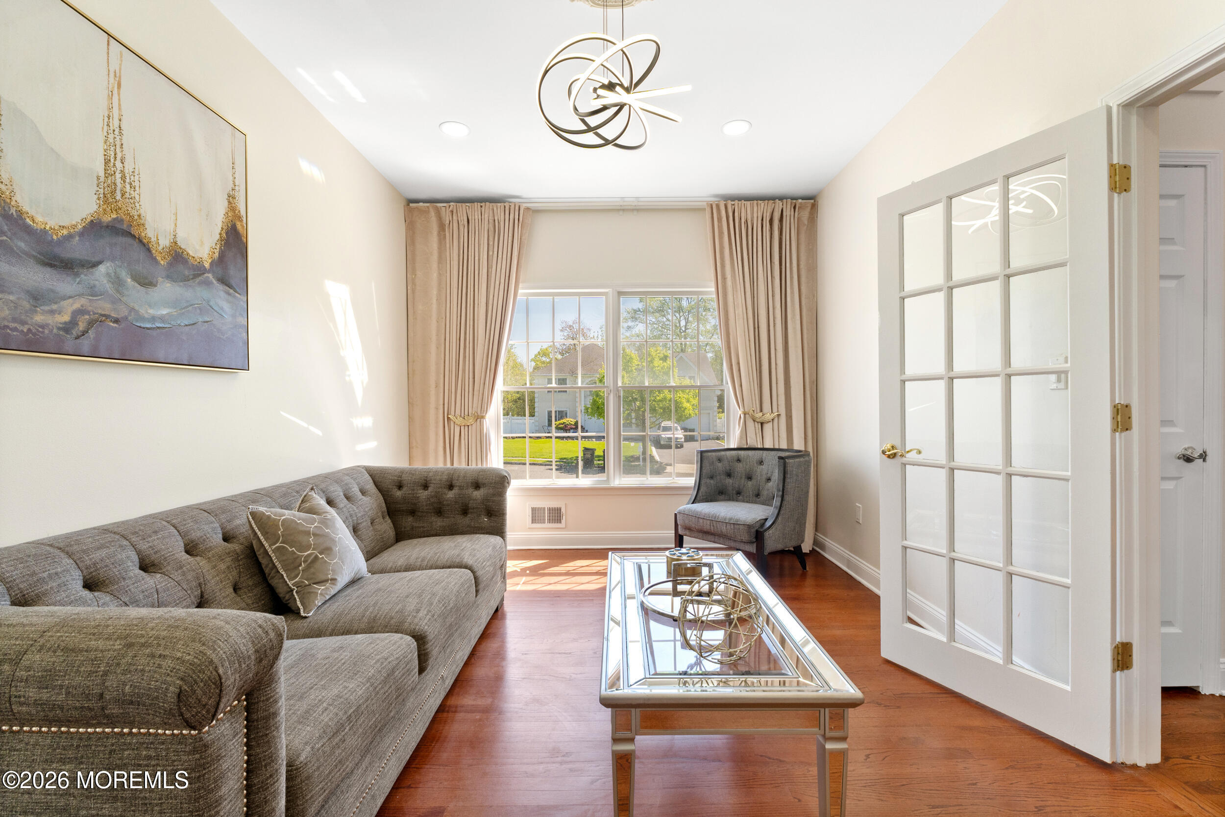 104 Autumn Road Matawan, NJ 07747 - Photo 7 of 64 a living room with furniture and a window
